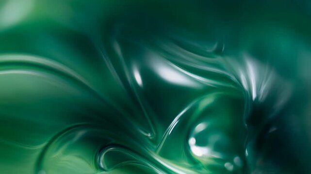 Glossy green abstract folds slowly shift across flowing curved surface as golden tones fade into emerald and teal, with bright white highlights tracing smooth ridges and deep shaded valleys