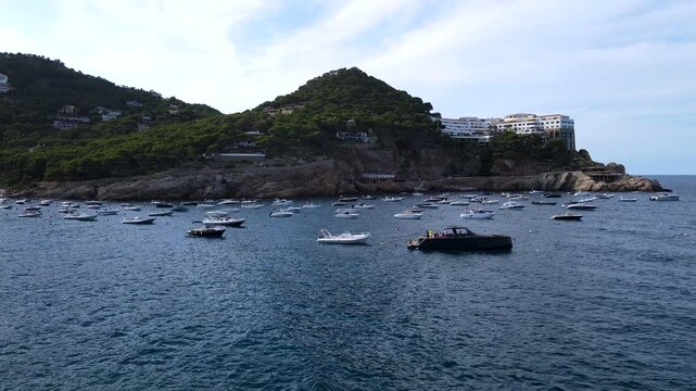 Boats moored in Cala d'Aiguafreda near Cap de Sant Josep in Begur, Spain. Aerial view of Costa Brava, Girona, Catalonia, Mediterranean Sea