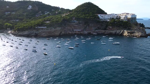 Aerial view of Cala d'Aiguafreda and the iconic Cap Sa Sal complex on the rocky headland. Coastline of Begur, Costa Brava, Girona, Catalonia, Spain