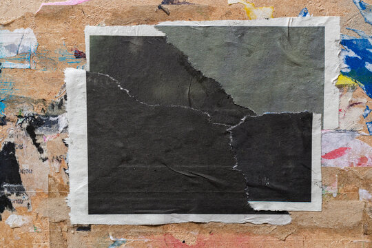 Pieces of Torn Black Newspaper Pasted onto Dirty Wooden Board in Shape of Rectangle for Industrial Grunge Background and Texture