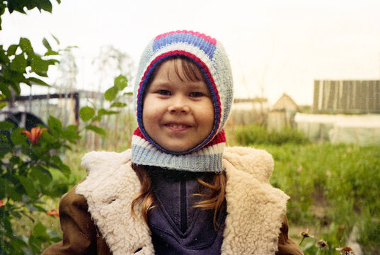 Smiling Girl in Winter Hat Outside