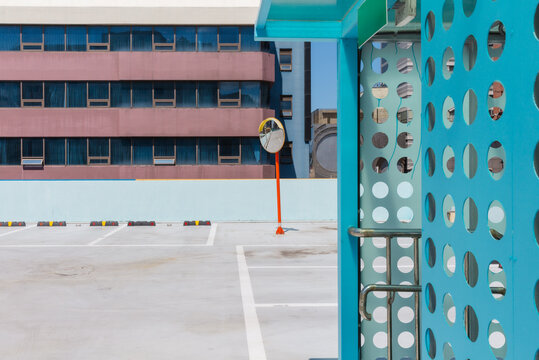 Convex Safety Mirror and Parking Lot Through Blue Structure