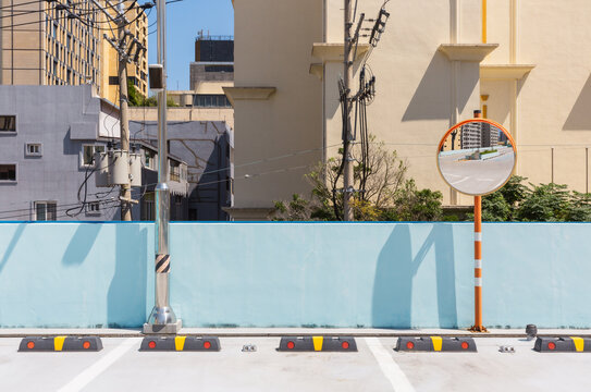 Convex Safety Mirror and Wheel Stops on Rooftop Parking Lot