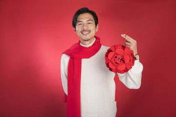 Happy Asian Man Holding Red Chinese Lantern for Lunar New Year Celebration © LaDieuNgoc