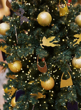 Christmas Tree Decorated With Golden Ornaments and Lights