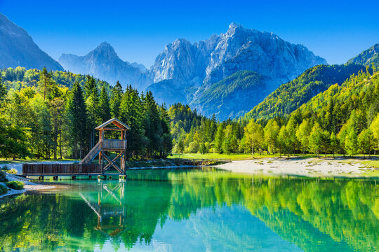 Observation tower on Jasna lake in Kranjska Gora, Slovenia. Julian Alps in background.