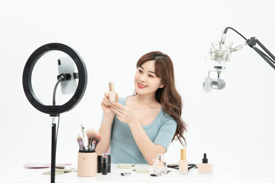 Beauty Influencer Livestreaming Cosmetics Product Review in Studio