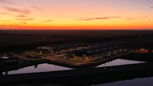 Aerial view of a large data center in Middenmeer at sunset