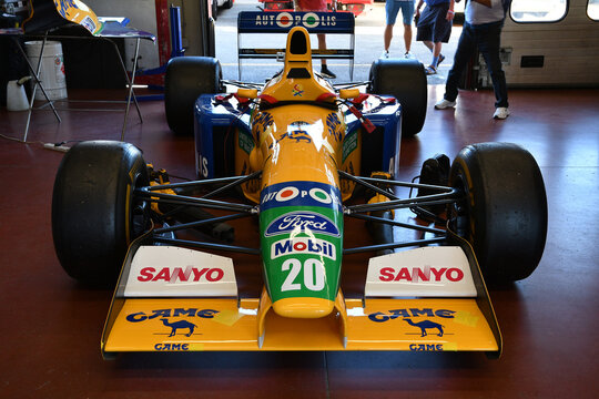 Scarperia, Italy - October 2th 2026: Benetton B191 of year 1991 ex Michael Schumacher and Nelson Piquet in the box during practice session at Mugello Circuit.