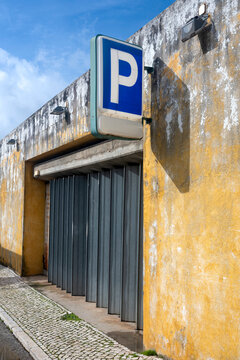 Garage Parking Entrance with Weathered Yellow Wall