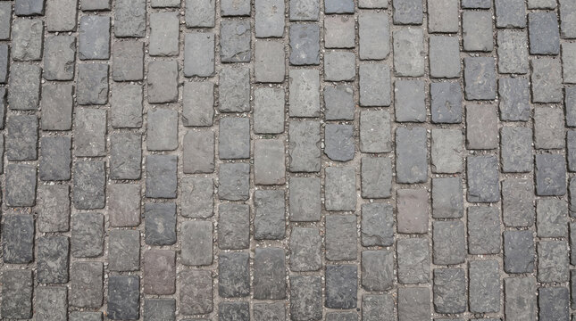 Grey cobblestone street texture background with rectangular stone