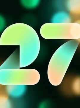 Fresh lime and mint rounded New Year number 27 with leaf shaped seven on dark forest green bokeh