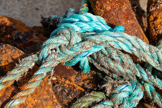 Weathered rope and rusty chains in the harbor of Ure in the Lofoten Islands