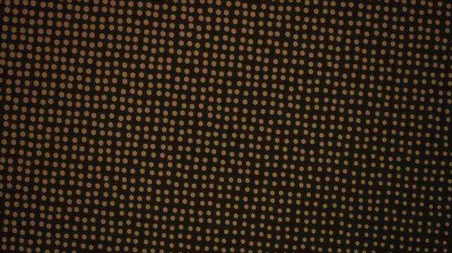 Abstract golden LED pixel grid, glowing yellow dot pattern on dark background, digital halftone texture for motion graphics and tech visuals