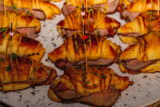 &bull; Oktoberfest catering buffet with traditional Bavarian canap&eacute;s, mini pretzel sandwiches, obatzda bites, and rustic finger food snacks.