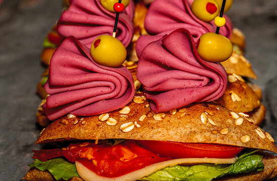 &bull; Oktoberfest catering buffet with traditional Bavarian canap&eacute;s, mini pretzel sandwiches, obatzda bites, and rustic finger food snacks.