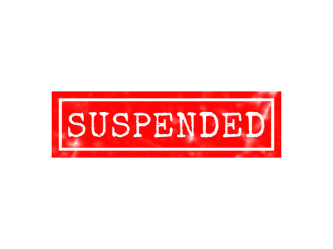 A rectangular red rubber stamp with the text suspended written in white capital letters, isolated on a solid black background, for account status isolated on a transparent background