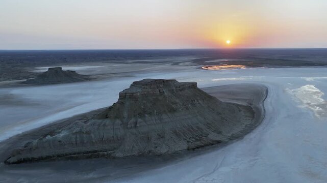 Sunset Flight Past Buttes and Reflective Salt Pools at Karynzharyk