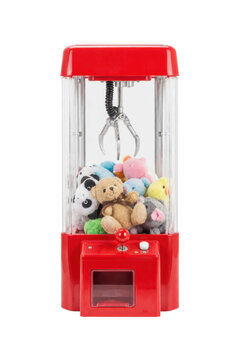 Vibrant red claw machine filled with an assortment of colorful plush toys and a metal claw, isolated on a white background