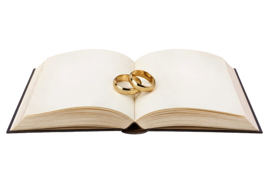 Two shiny golden wedding rings rest elegantly on the blank pages of an open book, symbolizing commitment and new beginnings