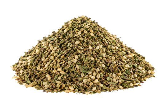 Vibrant pile of green za'atar spice mix with sesame seeds, captured in a studio shot against a clean white background