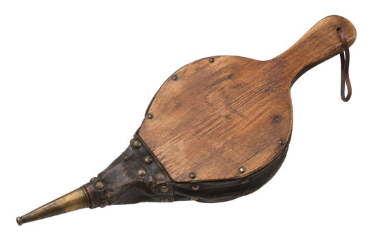 Antique wooden and leather fireplace bellows with a brass nozzle and rustic details, isolated on a clean white background