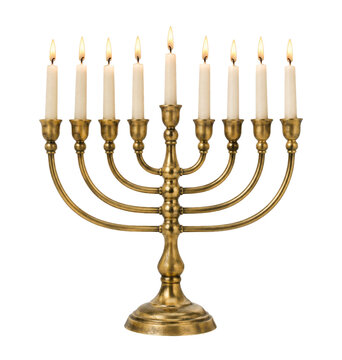 Traditional golden menorah with nine lit white candles stands prominently on a pure white background