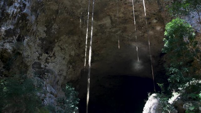 Large cave opening of a karst limestone tunnel in the jungle of central Belize, Central America