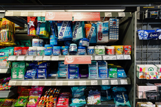 September 24, 2026, Amsterdam, Netherlands - Candies, chewing gums, and mints displayed on shelves in a SPAR supermarket