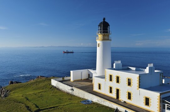 Fishing Boat and Rua Reidh Lighthouse, Melvaig, Gairloch, Wester Ross, Scotland, United Kingdom