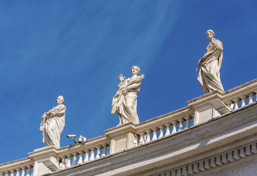 Statues of Saints Balbina, St. Lucy and St. Olympias on Bernini colonnades, St. Peter's Square, Vatican, Rome, Italy
