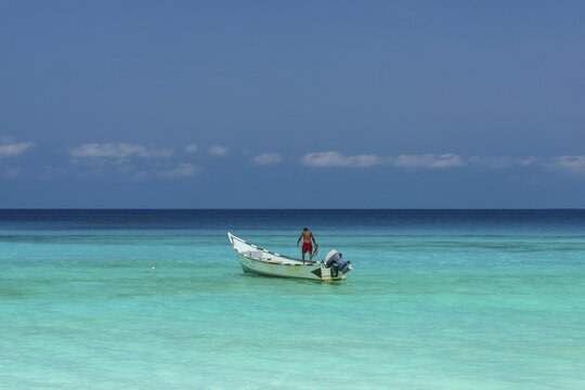 Fishing boat in the turquoise waters in Shuab Bay, island of Socotra, Yemen