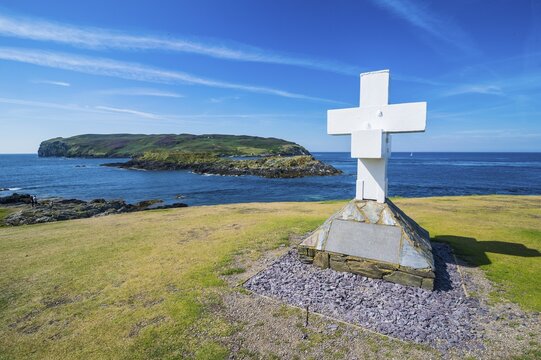 Huge cross before the small island calf of Man on the south side of the Isle of Man, United Kingdom