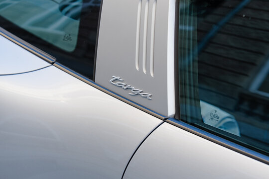 September 25, 2026, D&uuml;sseldorf, Germany - Close-up of the 'Targa' emblem and B-pillar on a white Porsche 911 Targa