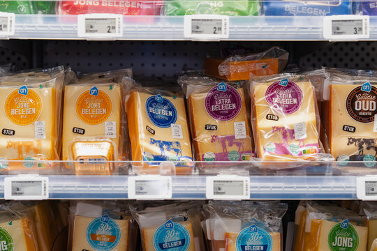 September 26, 2026, Amsterdam, Netherlands - Packaged Gouda cheese varieties on display at an Albert Heijn XL supermarket
