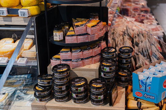 September 26, 2026, Amsterdam, Netherlands - Display of Old Amsterdam cheese products and other dairy items in an Albert Heijn XL supermarket