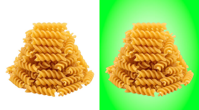 Golden fusilli pasta piles on green background