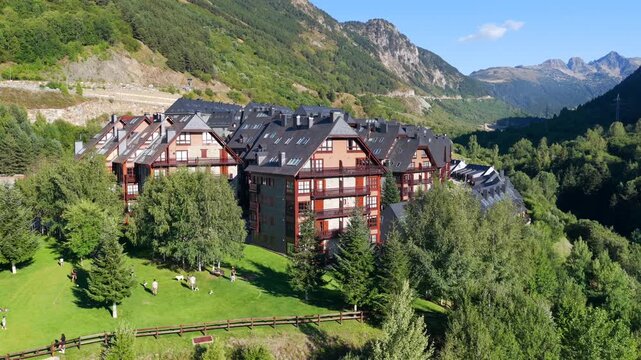 Aerial view of luxury chalets and slate-roof villas in Baqueira village during summer, Val d'Aran, Spanish Pyrenees, Spain