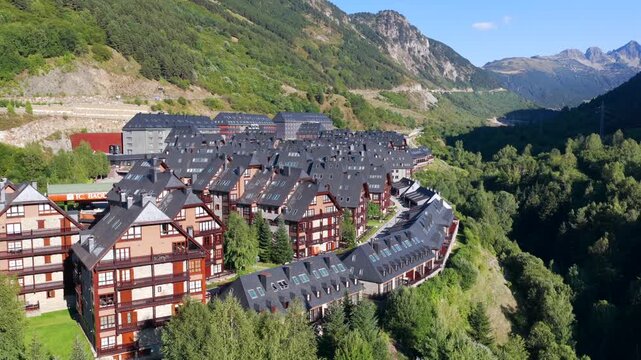 Aerial view of luxury chalets and slate-roof villas in Baqueira village during summer, Val d'Aran, Spanish Pyrenees, Spain