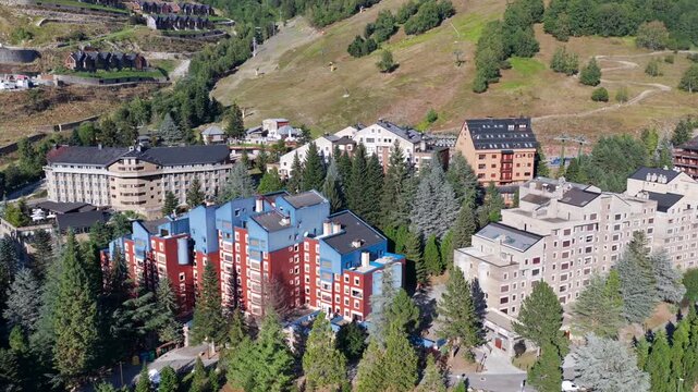 Aerial view of luxury chalets and slate-roof villas in Baqueira village during summer, Val d'Aran, Spanish Pyrenees, Spain