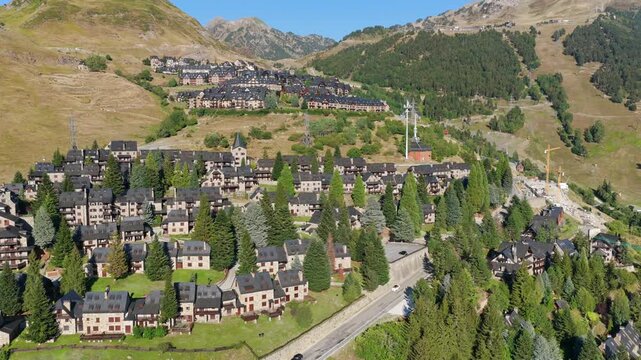 Aerial view of luxury chalets and slate-roof villas in Baqueira village during summer, Val d'Aran, Spanish Pyrenees, Spain