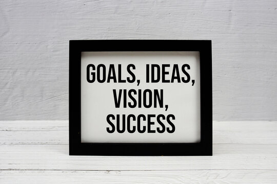 Goals, Ideas, Vision, Success text written on wooden frame
