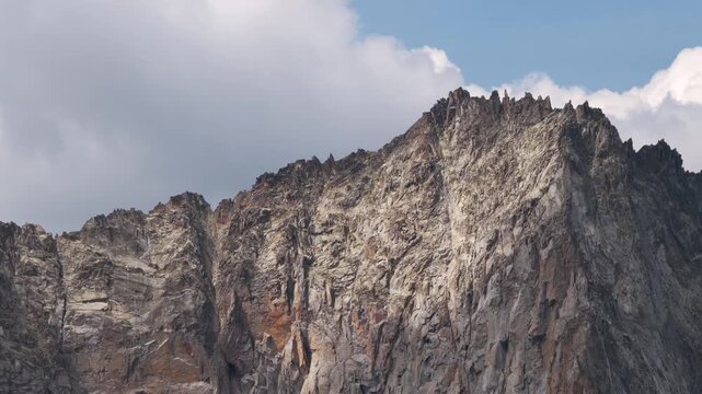 Aerial view of shrinking Monte Perdido glacier and exposed rock face due to climate change, Pyrenees, Spain