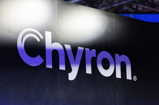 Amsterdam, Netherlands - September 11, 2026: Chyron brand logo illuminated on a black exhibition wall at the world's leading media and technology event IBC
