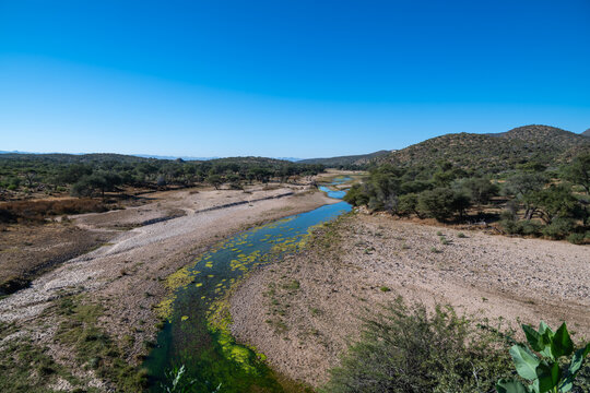 Aerial View of a River Meandering Through an Arid Landscape