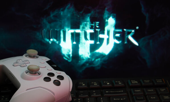 Warsaw, Poland - 10 Oct 2026: A game controller in front of a The Witcher IV Game screen.