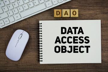 DAO Data Access Object message with keyboard and optical mouse on wooden background © may1985