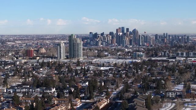 Aerial view of the downtown Calgary skyline and surrounding neighborhoods blanketed in snow, Alberta, Canada.