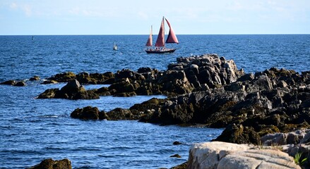 Schooner with Red Sails in a Maine Harbor © Peter