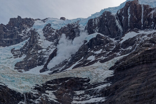 Ice avalanche from hanging glacier serac fall in Torres del Paine